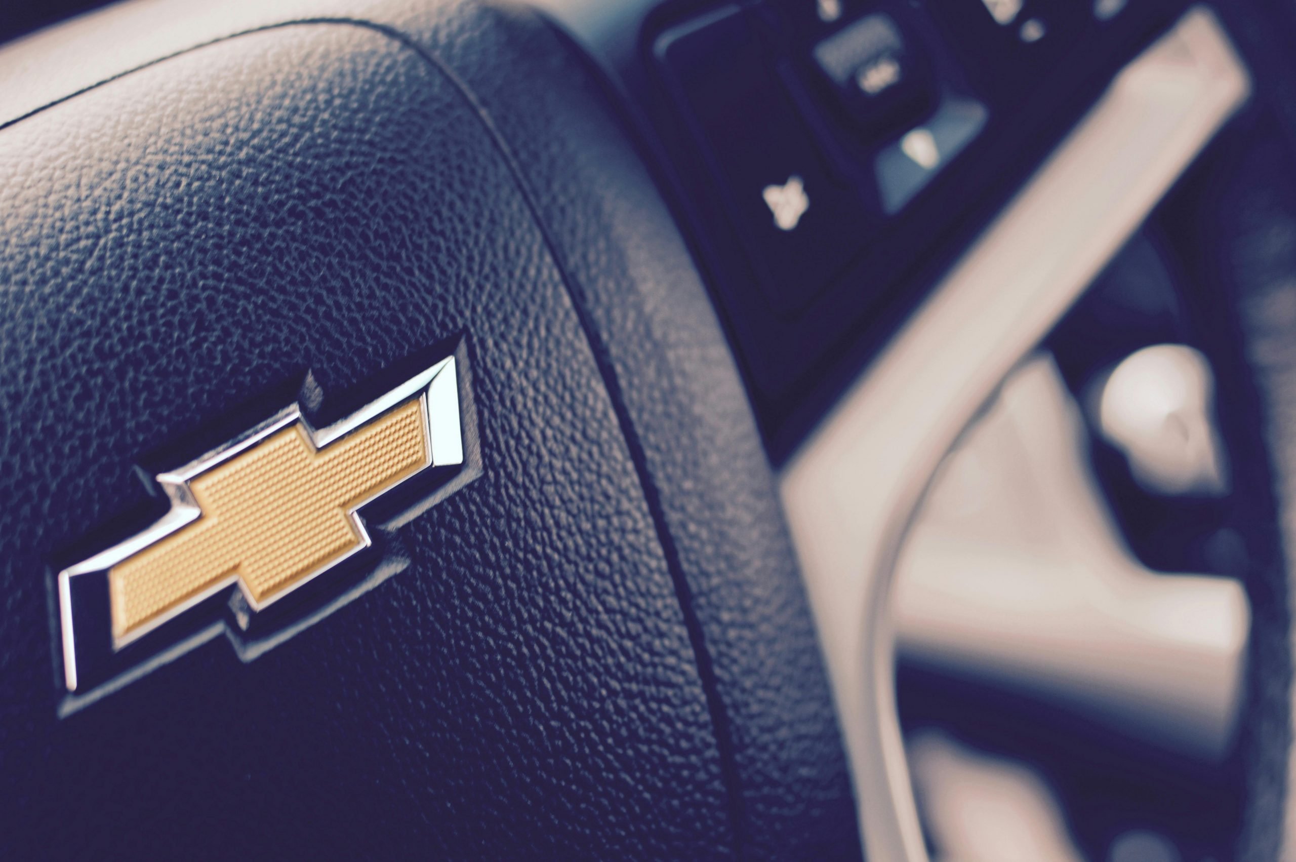 Closeup of the Chevrolet logo on a steering wheel