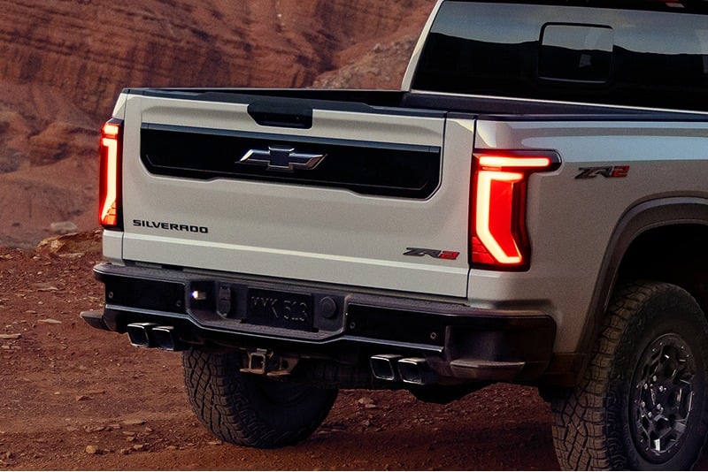 Rear view of a 2027 Chevrolet Silverado 1500 ZR2 with LED taillights illuminated