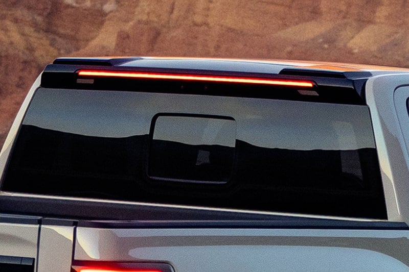 Close-up of the rear window and upper brake light on a 2027 Chevrolet Silverado 1500