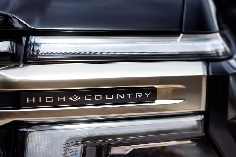 Close-up of High Country badging and exterior lighting on a 2027 Chevrolet Silverado 1500