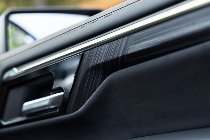 Premium interior door trim and metallic door handle in a 2027 Chevrolet Silverado 1500 High Country