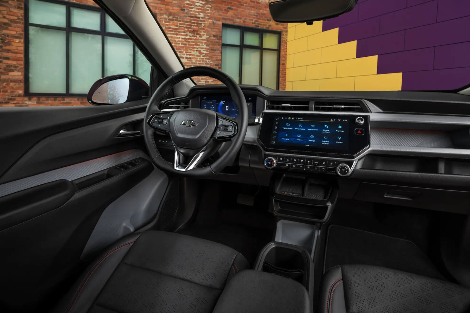 Chevrolet Bolt interior showing the front seats, dashboard, and infotainment screen
