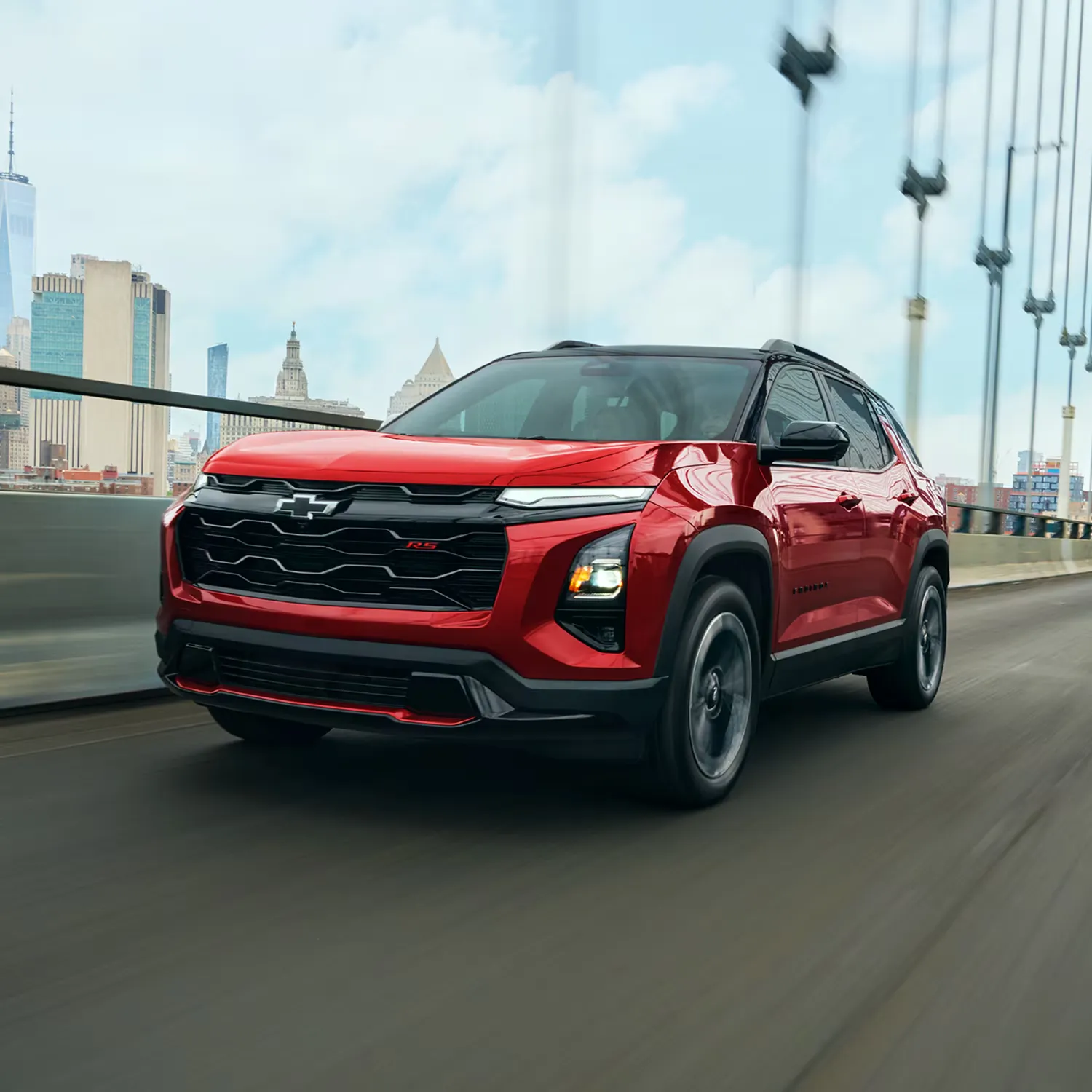 Chevrolet Equinox 2027 rouge roulant sur un pont.
