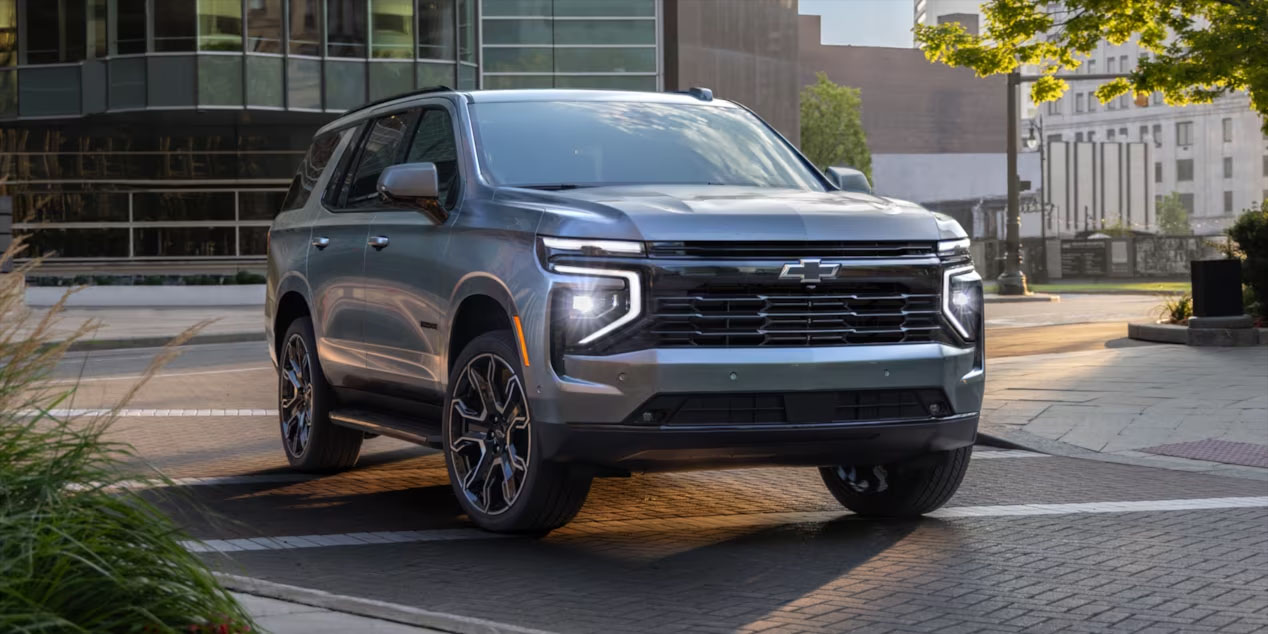 2025 chevrolet suburban silver pulling into driveway slider_widget-106-2
